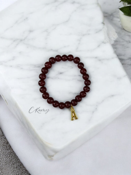 Bracelet femme perles de verre initiale doré bordeaux