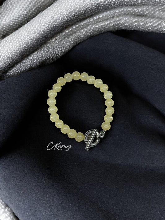 Bracelet femme perles de verre toggle jaune champagne