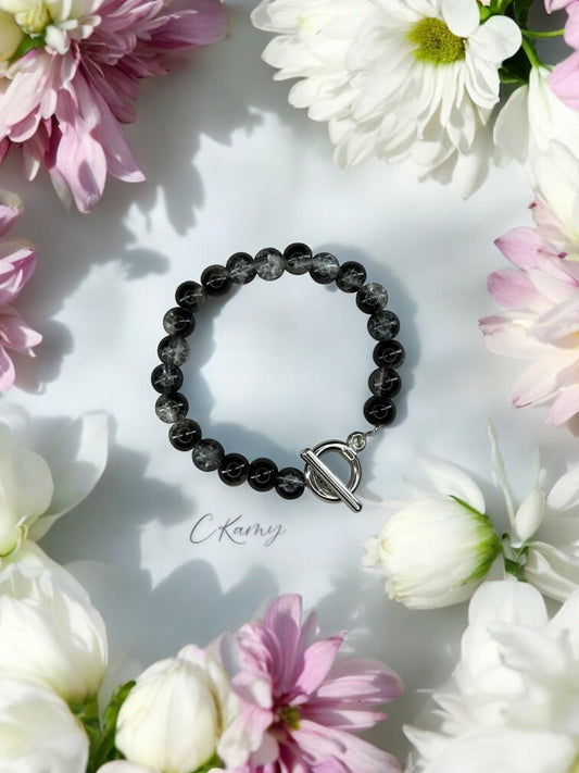 Bracelet femme perles de verre toggle noir transparent craquelé