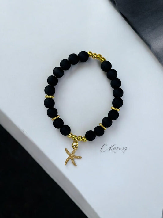 Bracelet femme perles mattes fine étoile de mer noir