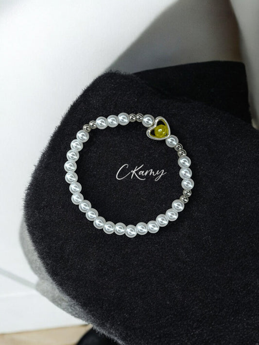 Bracelet femme perles nacrées coeur facette jaune