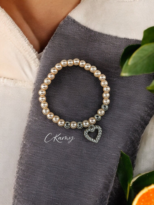 Bracelet femme perles nacrées rose saumon coeur perlé