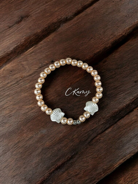 Bracelet femme perles nacrées rose saumon coquillages