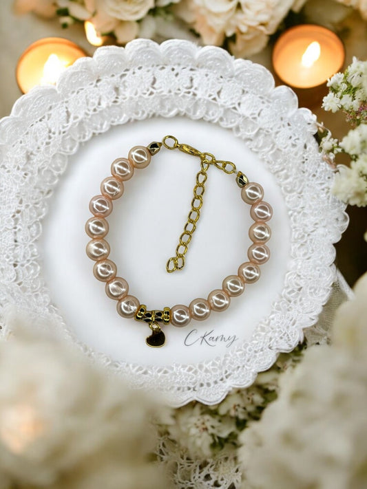 Bracelet femme petit coeur doré chair clair brillant