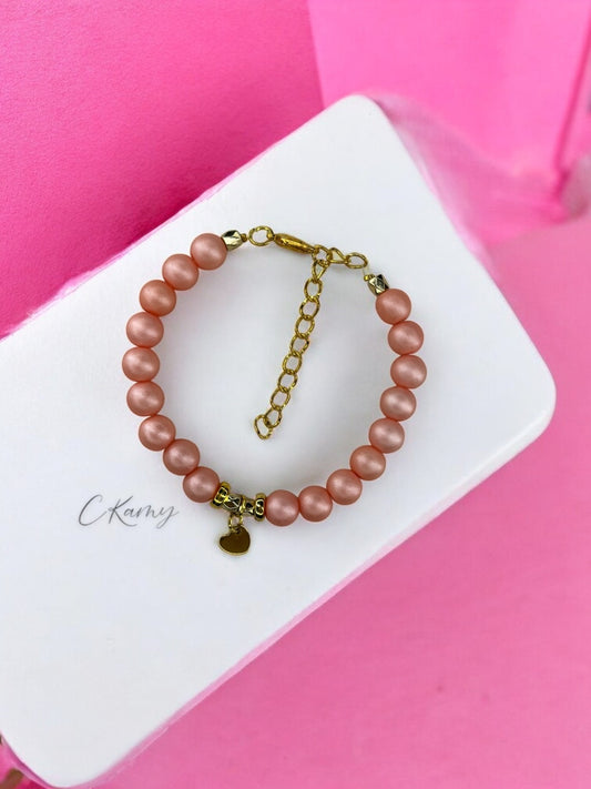 Bracelet femme petit coeur doré rose corail mat