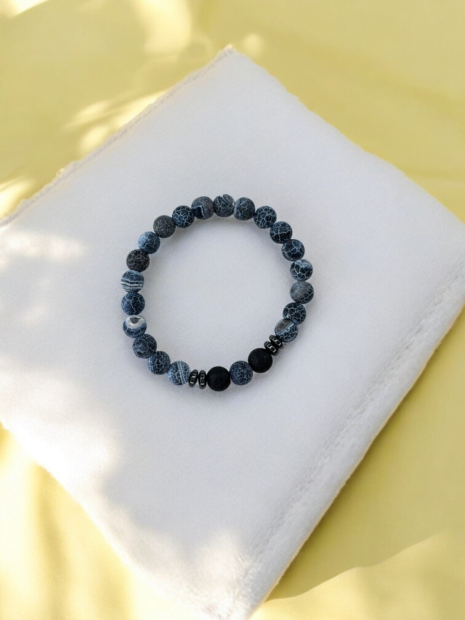 Bracelet homme intercalaires milieu une perle gris