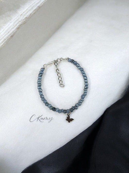 Bracelet papillon rocaille gris tacheté foncé