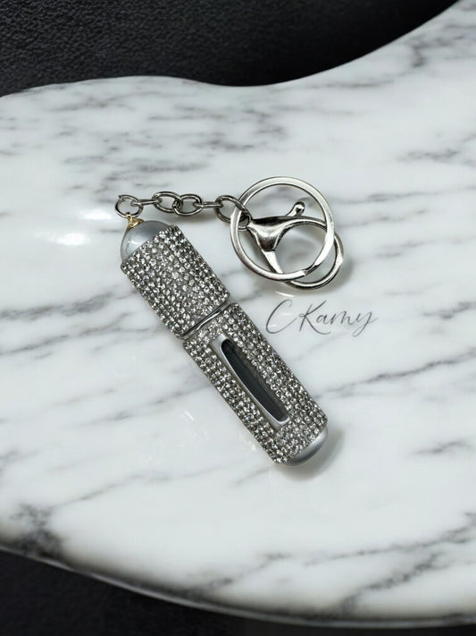 Porte clé contenant pour parfum argent