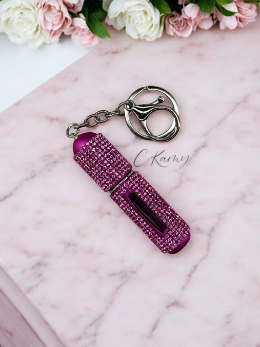 Porte clé contenant pour parfum rose