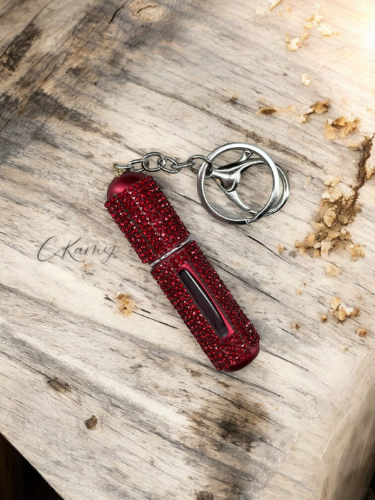 Porte clé contenant pour parfum rouge