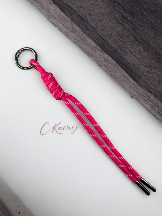 Porte clé lacet noué rose flash