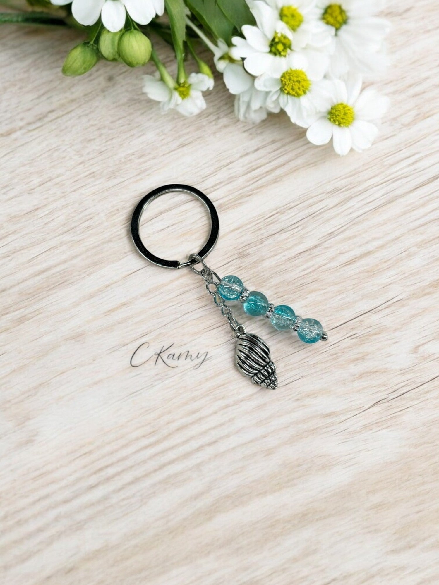 Porte clé personnalisé coquillage bulot bleu