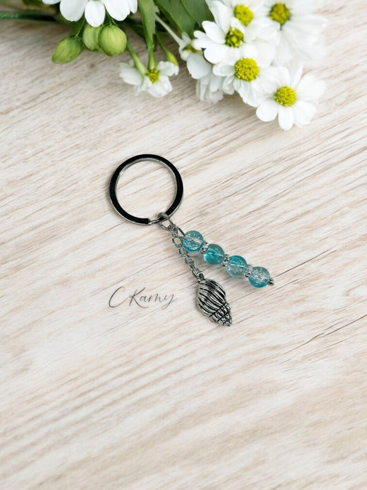 Porte clé personnalisé coquillage bulot bleu