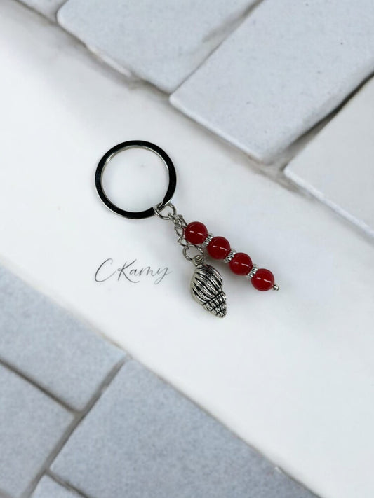 Porte clé personnalisé coquillage bulot rouge