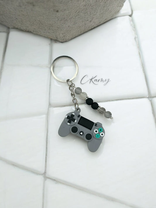 Porte clé personnalisé manette play gris