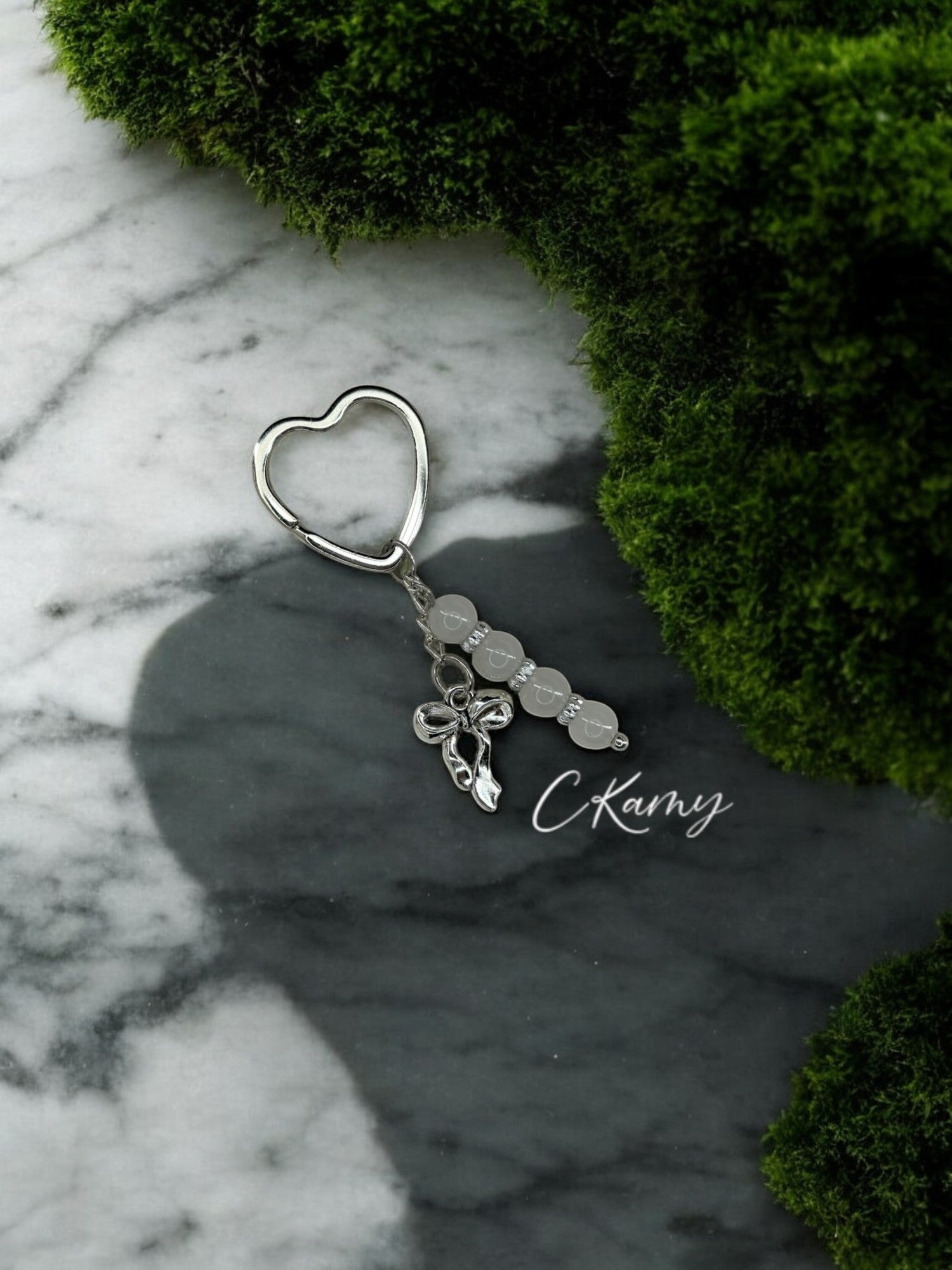 Porte clé personnalisé noeud blanc grisé