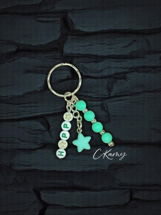 Porte clé personnalisé petite étoile bleu vert rond