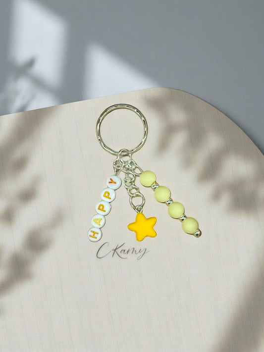 Porte clé personnalisé petite étoile jaune rond
