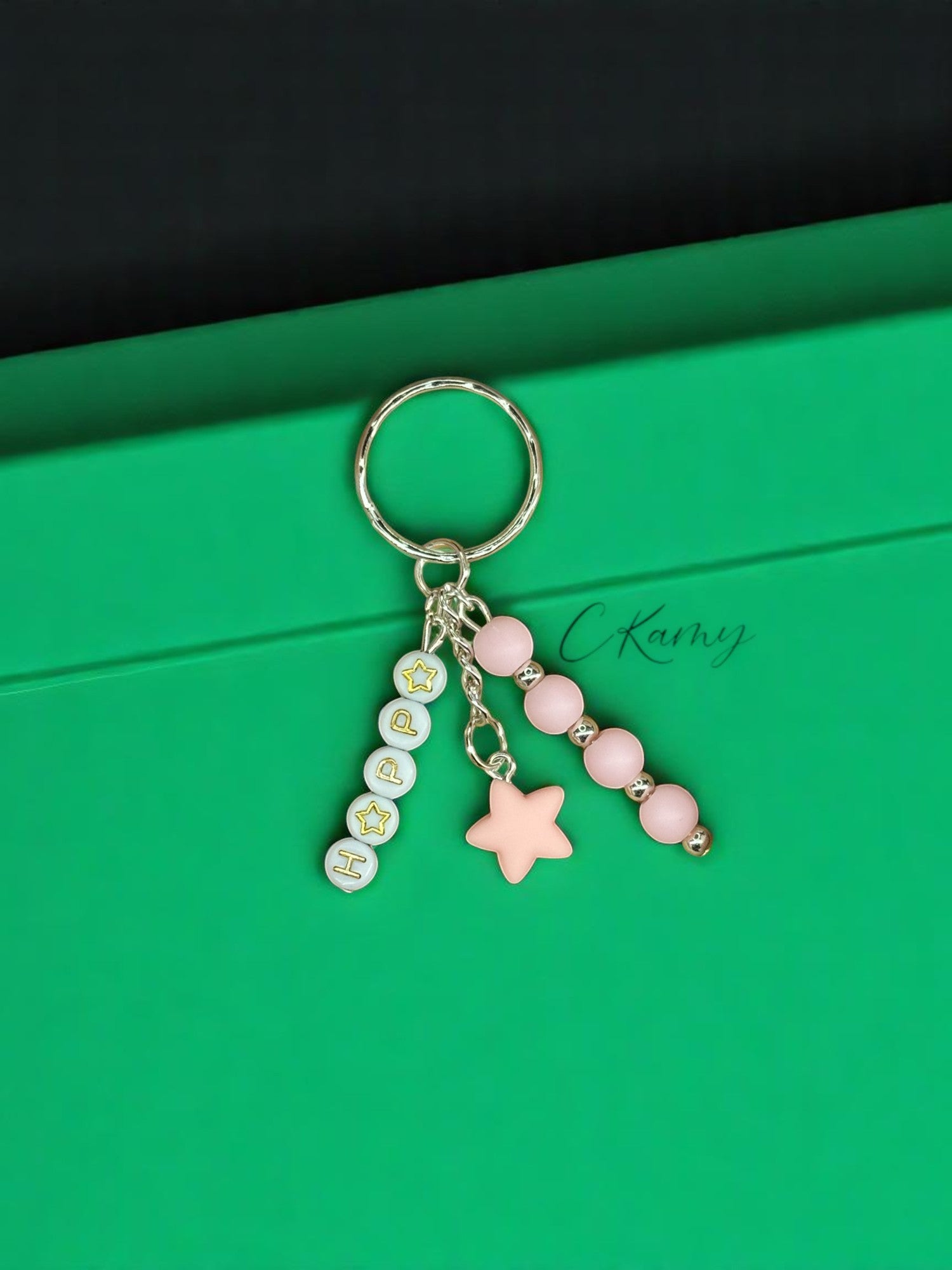 Porte clé personnalisé petite étoile rose clair rond