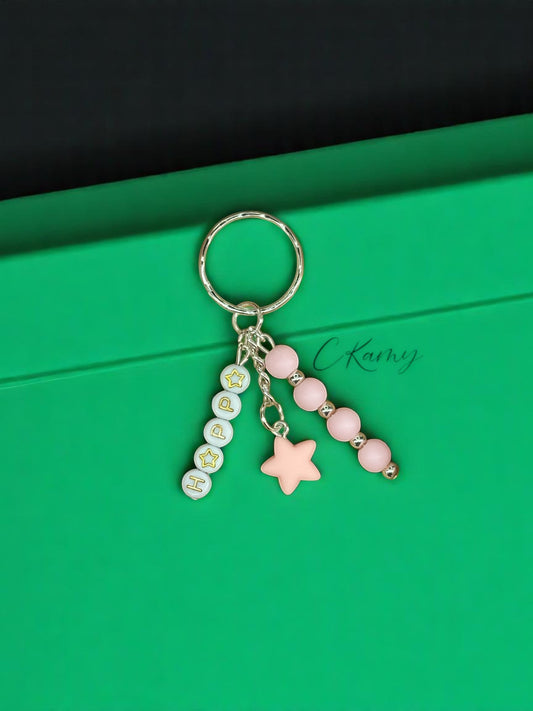 Porte clé personnalisé petite étoile rose clair rond