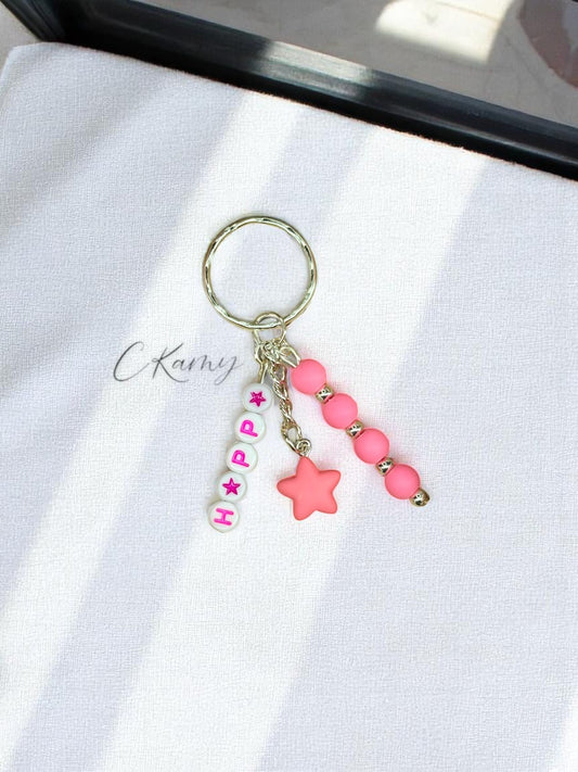 Porte clé personnalisé petite étoile rose flash rond