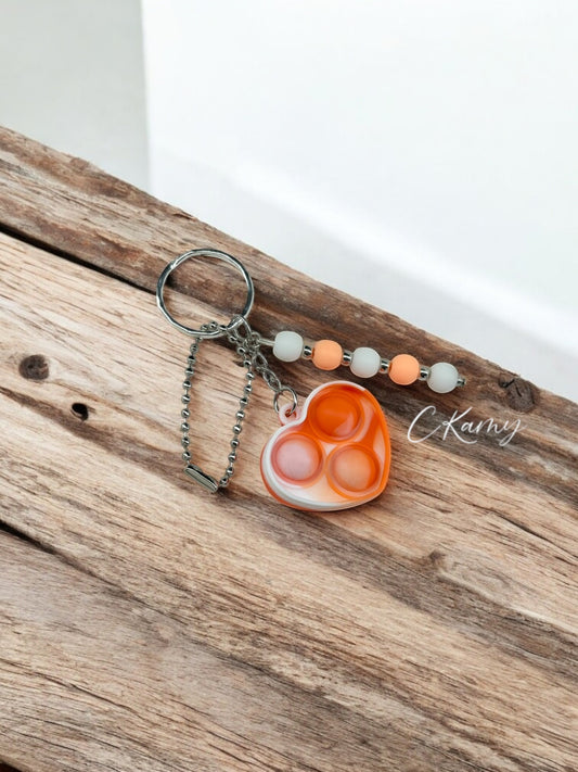 Porte clé personnalisé pop it coeur blanc orange