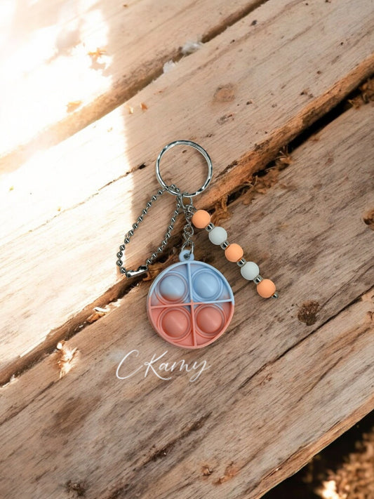 Porte clé personnalisé pop it rond blanc orange