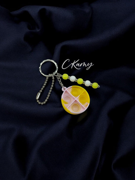 Porte clé personnalisé pop it rond jaune blanc rosé
