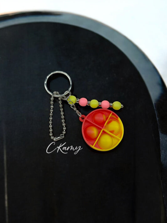 Porte clé personnalisé pop it rond jaune rose