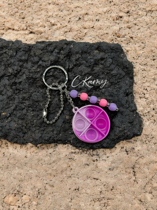 Porte clé personnalisé pop it rond violet rose