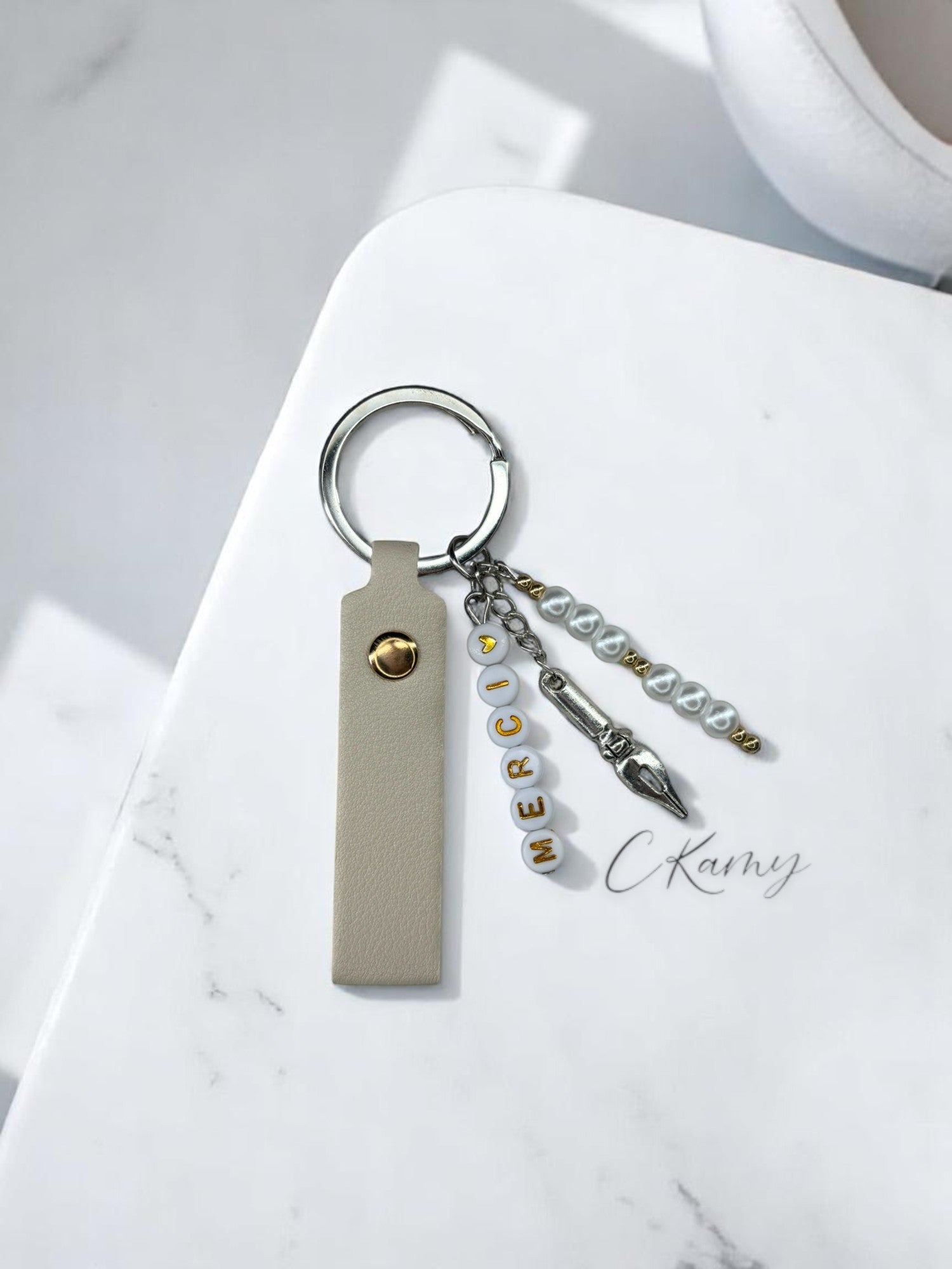 Porte clé personnalisé stylo plume