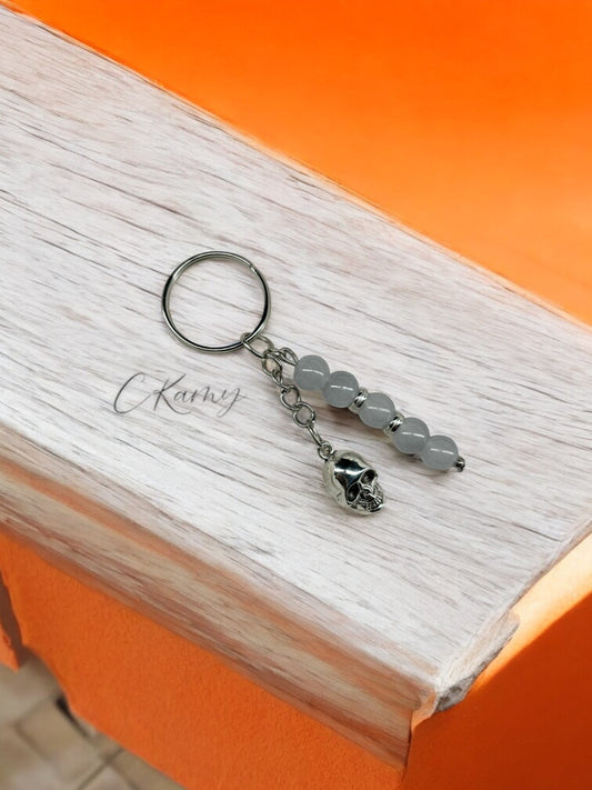 Porte clé personnalisé tête de mort gris